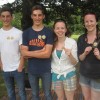 picture of four people under a tree