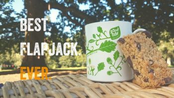 Flapjack and mug of tea under a tree